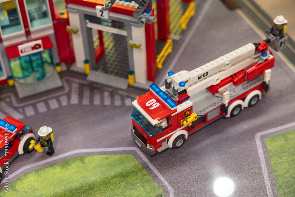 Fototapeta premium LEGO City fire truck with ladder and fire station display