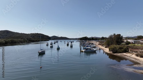 Aerial Morning Drone Shot Over Boats and Calm Water at Woy Woy, NSW, Australia on a Clear Sunny Day