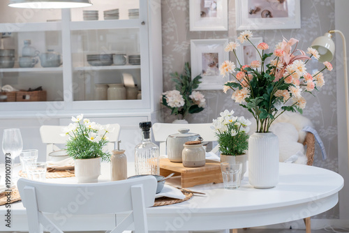 Canvas Print Elegant white dining table setting with fresh spring flowers and minimalist decor