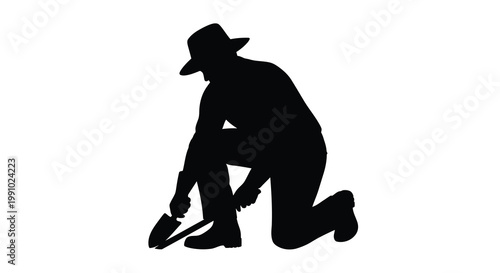 Silhouette of a gardener kneeling and tending to the earth