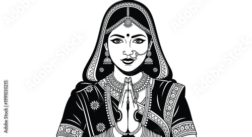 Traditional Indian woman in prayer with intricate jewelry and ornate clothing