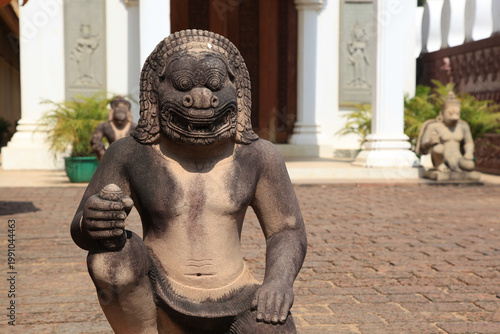 Cambodian Royal Palace: Ancient Sculpture of a Monk in Meditatio