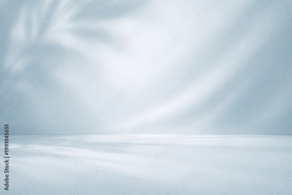 Obraz premium Elegant pale blue smooth background emphasizing shadow play for product presentations