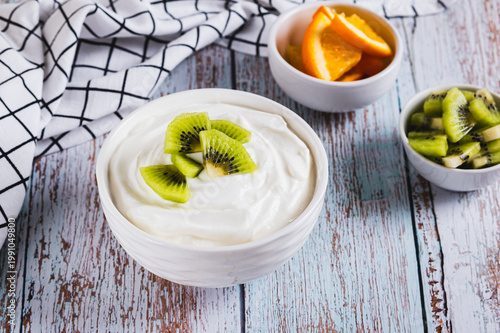 Skyr, a high-protein dairy product, and fruit in a bowl on a table