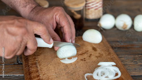 men cutting onion at kitchen