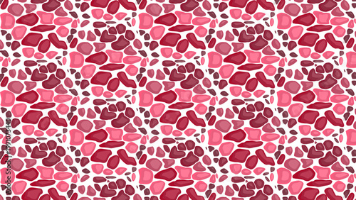 Pink and red stones form a vibrant, repeating pattern. Stones vary in size and tone, creating visual texture. White spaces between stones add contrast and rhythm. Pattern flows uniformly