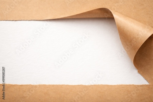 brown paper peeled back uncovering white surface featuring copy space
