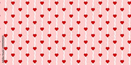 Seamless red hearts in vertical wavy stripe pattern for Valentine wrapping paper, textile and romantic stationery