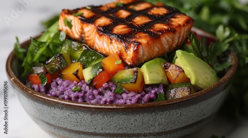 Flame finished grilled salmon steak with perfect crosshatch grill marks served over purple rice poke bowl with fresh vegetables and avocado in premium ceramic dish