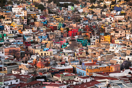 Vibrant hillside view of colorful colonial architecture in Guanajuato Mexico at sunset showcasing urban landscape and cultural heritage