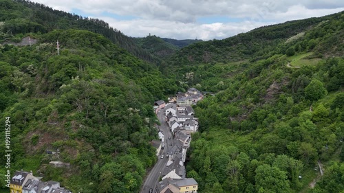 Aerial view village in green valley forest hills Germany