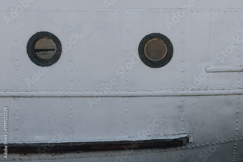 Two Portholes on White Ship Hull