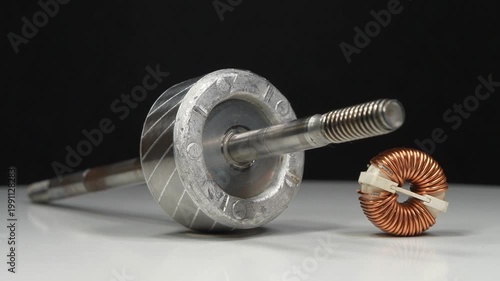 Metal armature or rotor from electric motor and copper coil from electrical appliances