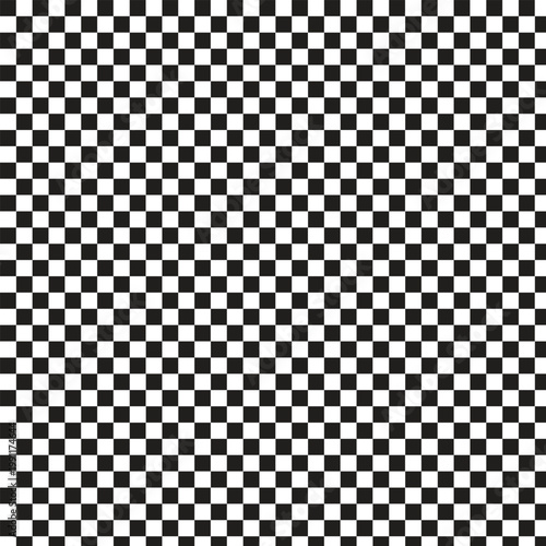 A checkered pattern gradually fades from dense black and white squares to a blurry gradient