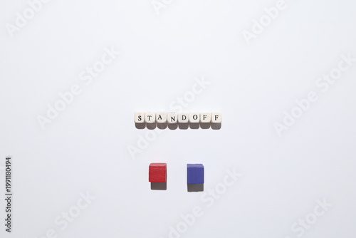 Schilderij op canvas STANDOFF word with red and purple cubes representing deadlock, confrontation and unresolved conflict