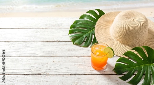 Tropical cocktail with lime and straw hat on white wooden table. Vacation concept with monstera leaf at seaside. Refreshing summer drink for holiday relaxation and beach leisure travel.