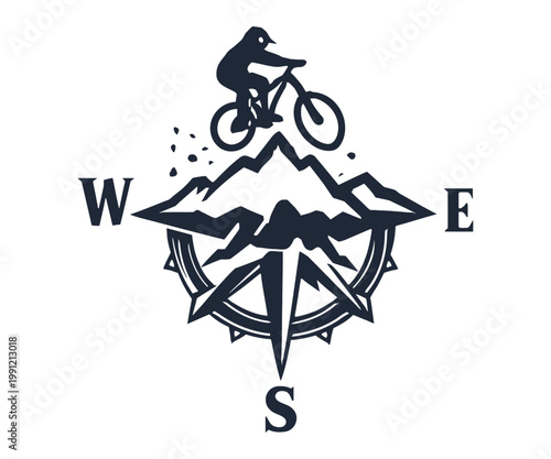 Mountain biker riding above compass mountains