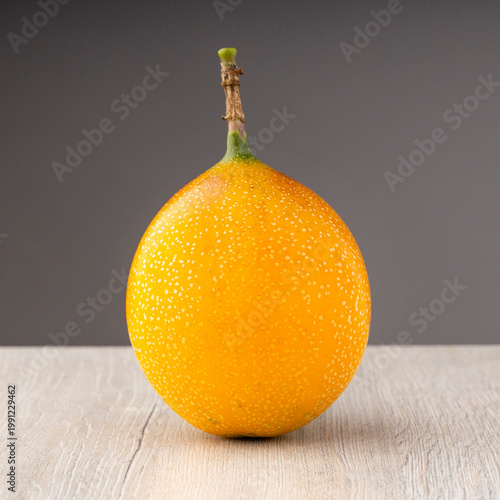 Ripe granadilla isolated on a gray background - Passiflora ligularis