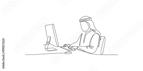 A man in traditional arabic clothing sitting at a desk working on a computer isolated on white background