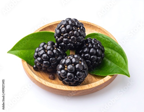 Fresh Blackberries on Wooden Plate.