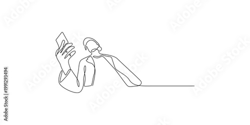 Person reading a book while sitting at a table with learning education knowledge information intelligence literature