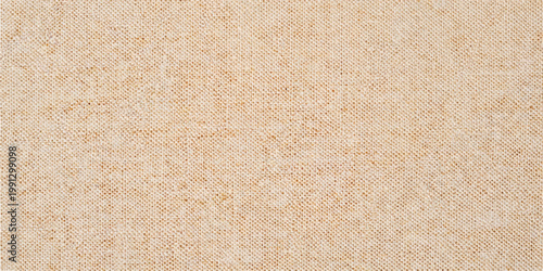 A seamless brown kraft paper and cardboard texture with a rough, vintage grunge surface and aged beige carpet pattern for a blank antique material backdrop
