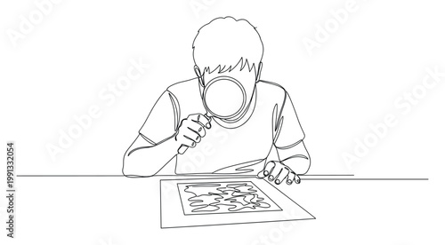 Young person using magnifying glass to closely examine an abstract drawing on a desk, perfect for educational and discovery themes.