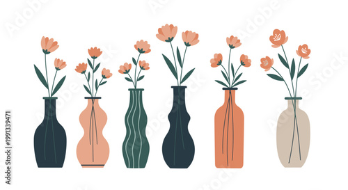 Arrangement of several vases with different shapes and colors holding delicate pink flowers and green leaves on a plain white background.