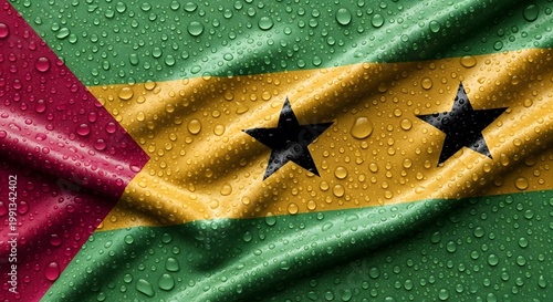 Close-up view of the national flag of São Tomé and Príncipe covered in glistening water droplets.