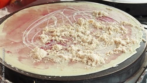 Thai style crepe on hot pan. Dried Shredded Pork and Blueberry Jam.