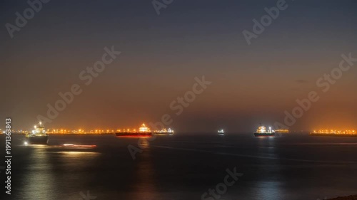 Cargo Ships and Oil Tankers in the Strait of Hormuz at Sunset