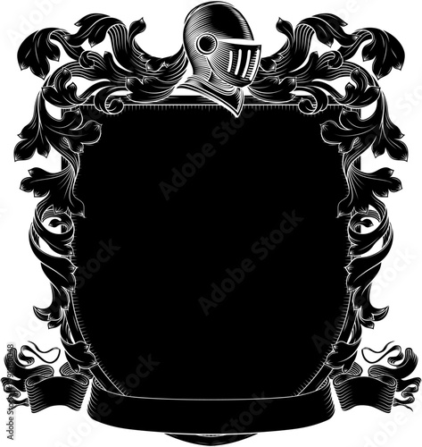 A coat of arms or crest family heraldry medieval heraldic knight shield with helmet and acanthus filigree scroll ornament in a vintage woodcut style.