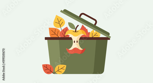 Green organic waste bin filled with autumn leaves and apple core.