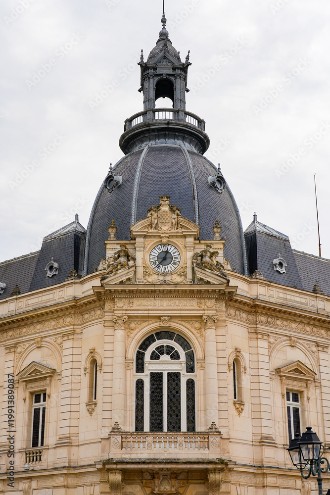 Fototapeta premium Elegant 19th-century Beaux-Arts building with a grand imperial dome, ornate clock, and stone carvings in Dreux, France