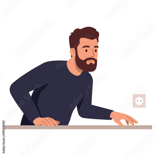 Man leaning over a table reaching for an electrical outlet curiously