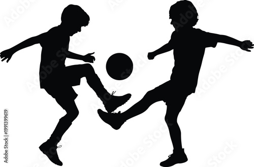 Action Silhouette of Two Young Boys Playing Soccer Together