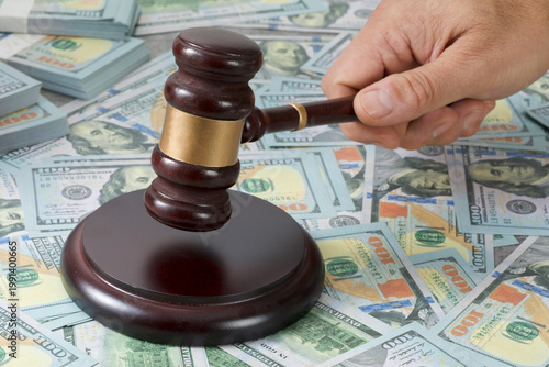 judge gavel and money on table