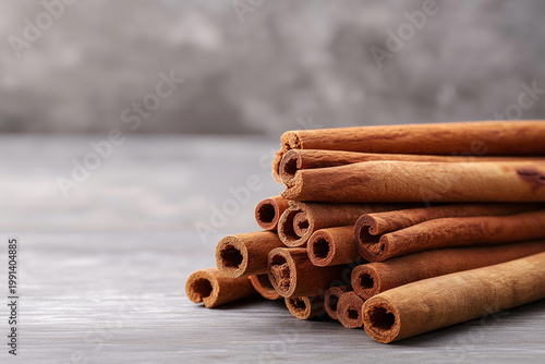 Cinnamon sticks on a dark wooden background