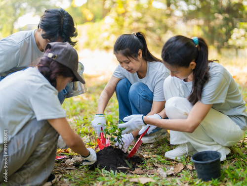 Bild auf Leinwand Asian volunteers planting trees for environmental conservation sustainable eco p