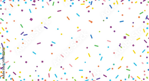 Colorful sprinkles on white background.