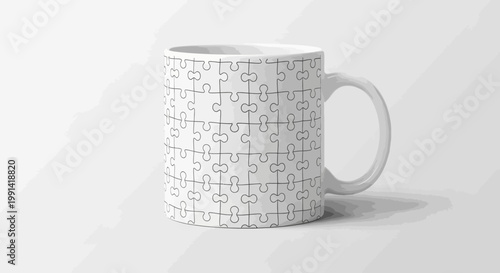 A white ceramic mug with a puzzle pattern sits on a plain surface.
