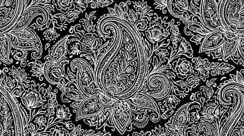 Intricate black and white paisley pattern with damask motifs and arabesque swirls on textile background.