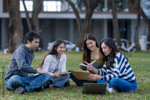 Принти на полотні Diverse students studying together on university campus lawn