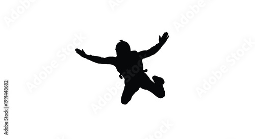 Silhouette of a skydiver falling through the air with arms outstretched