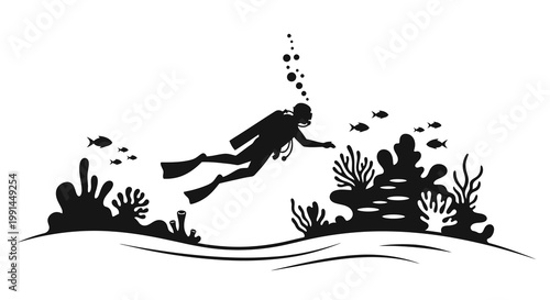 Silhouette of a scuba diver exploring a coral reef ecosystem