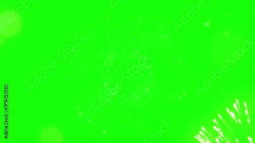 A vibrant green screen video with a bright light explosion in the corner
