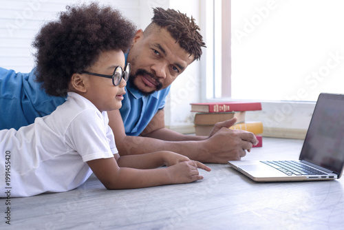 African father is teaching his son