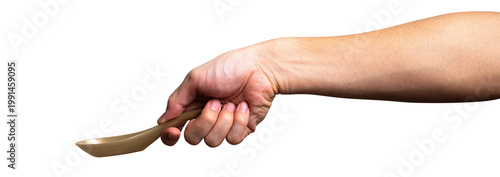 Male hand holding a gold plastic spoon isolated on white background with a clipping path.