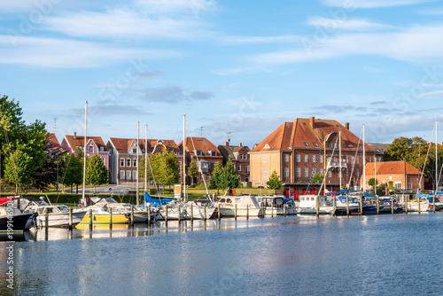 Den gamle toldbod, old customs house, and historic houses on Skibbrogade with boats in harbour of Haderslev, South Jutland, Southern Denmark