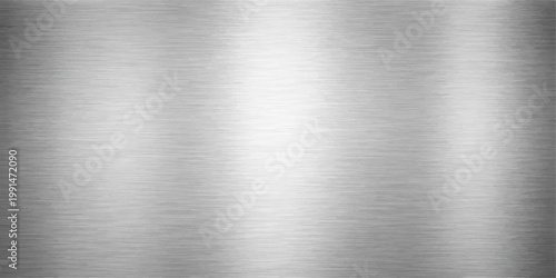 A polished stainless steel plate with a brushed metal texture creates a shiny silver metallic pattern on a grey industrial aluminum sheet material